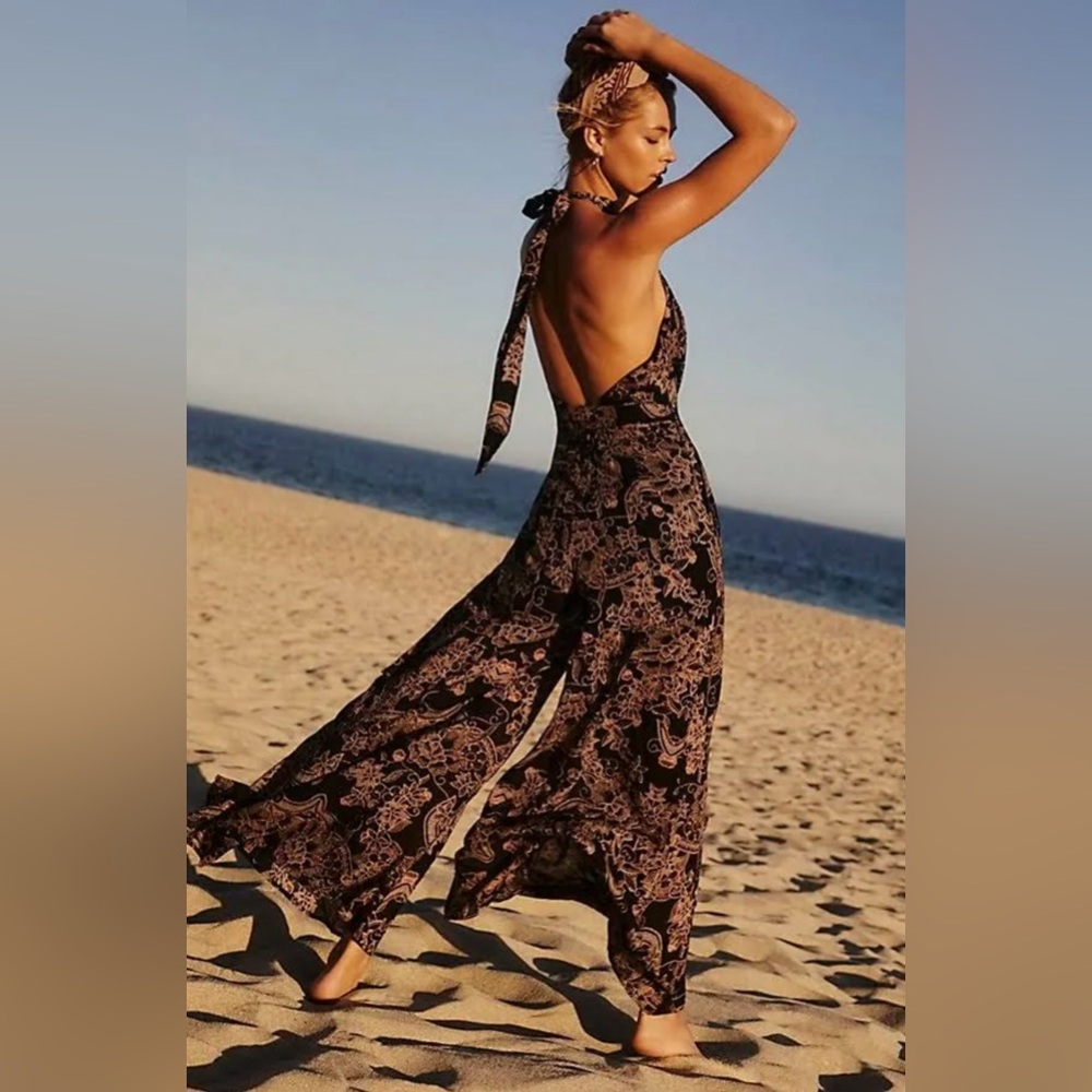 Free People “Kussing Sunlight” jumpsuit black orange open back halter neck tie S